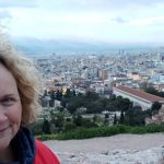 A windy view of Ellen surveying Athens from the Rock