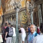 Peeking over second floor balcony